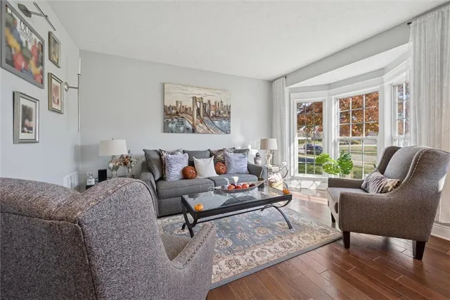 a view of entryway dining room and hall with wooden floor
