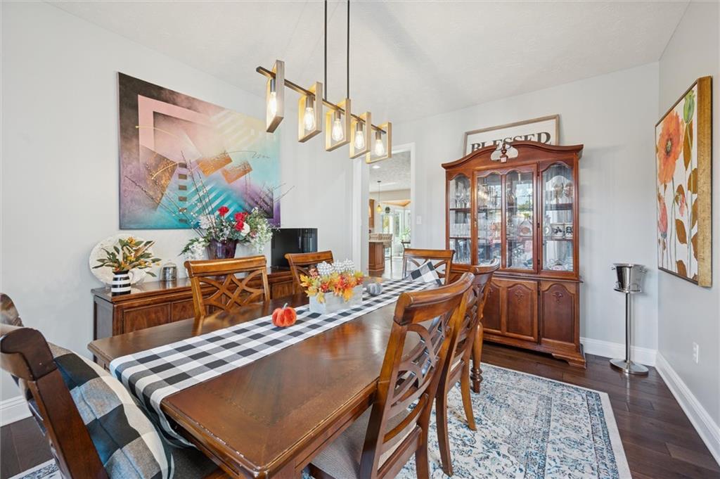 1005 Autumn Woods Drive Coraopolis, PA 15108 - Photo 7 of 50 a dining room with furniture a rug and wooden floor