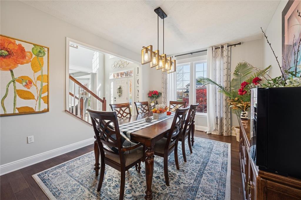 1005 Autumn Woods Drive Coraopolis, PA 15108 - Photo 8 of 50 a view of a dining room with furniture and a chandelier