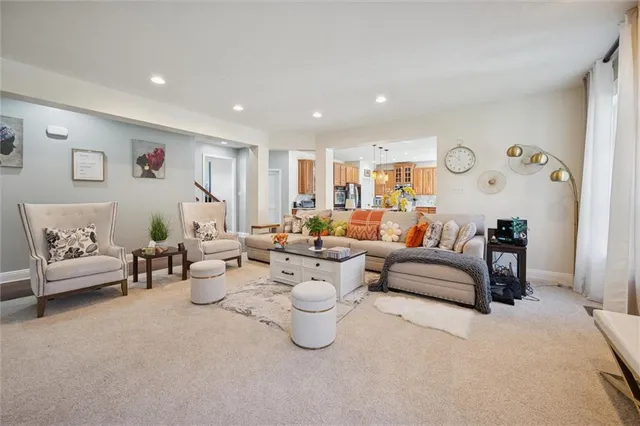 a very nice looking living room with furniture and a large window