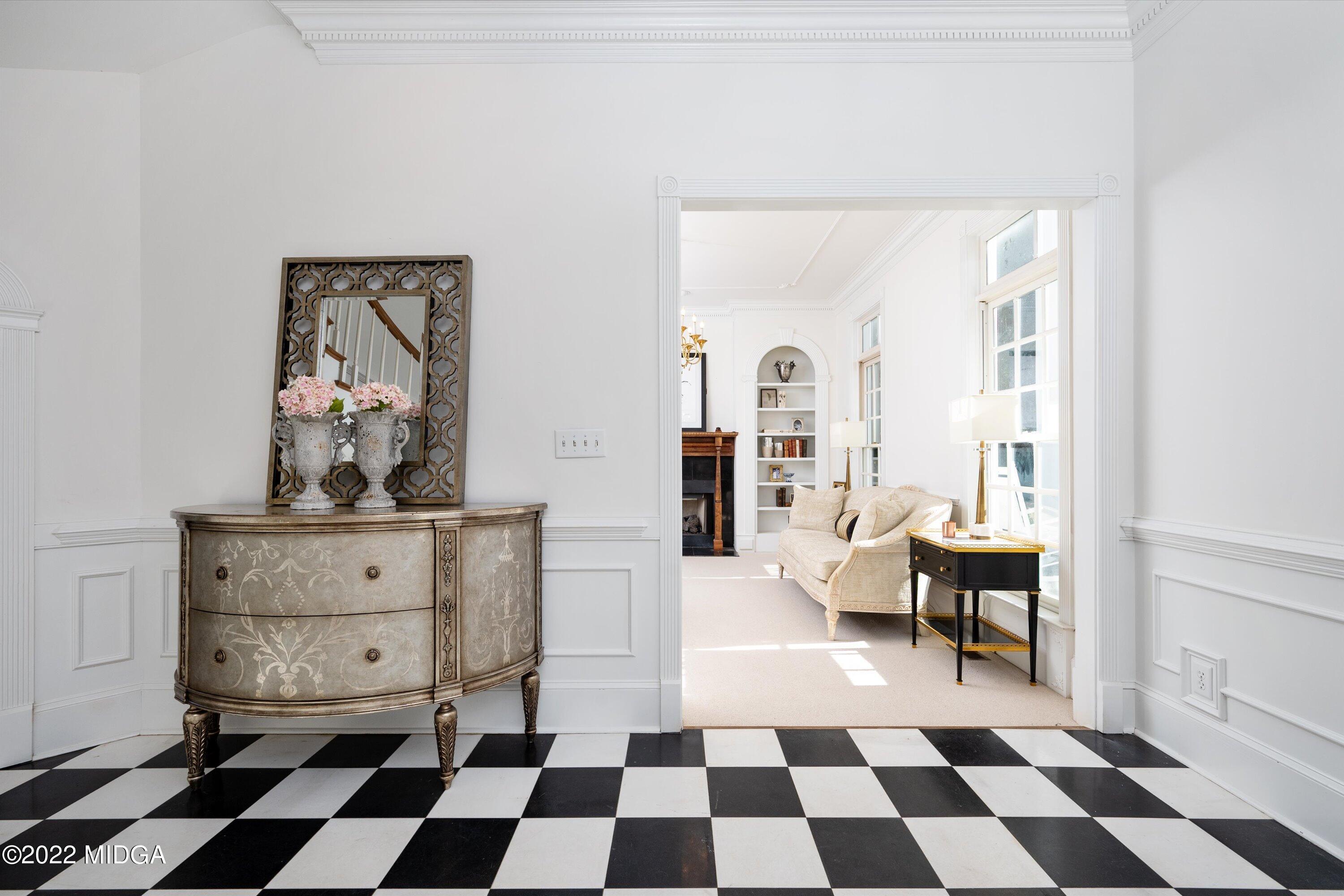 6900 Forsyth Road Macon, GA 31210 - Photo 8 of 56 a living room with a black white checkered floor with a black white checkered floor and a potted plant
