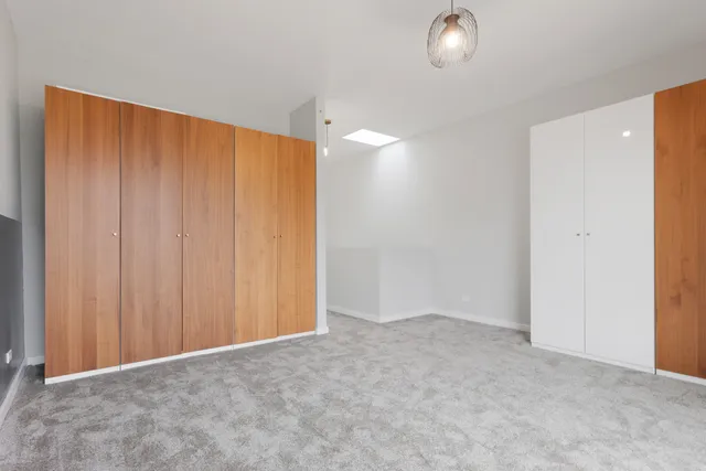 a view of an empty room with a entryway