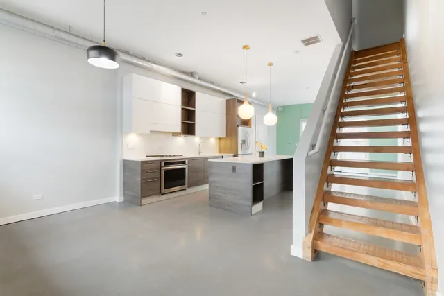 a view of a kitchen with furniture and a fireplace