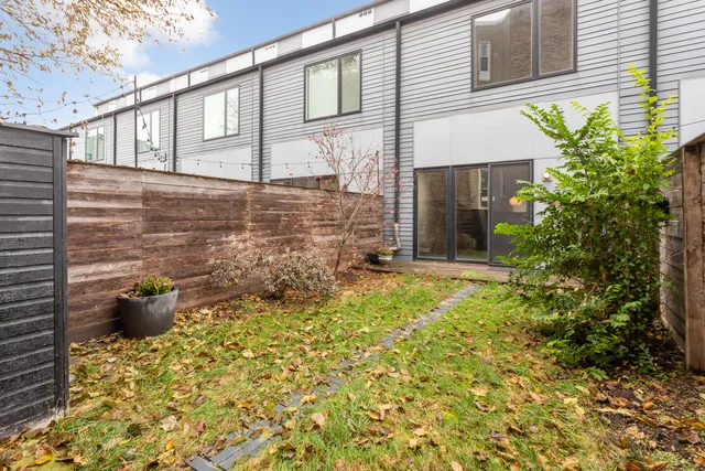 a couple of potted plants in front of door