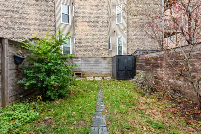 a view of a plants with brick walls