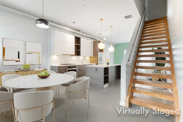 a kitchen with furniture and a view of living room