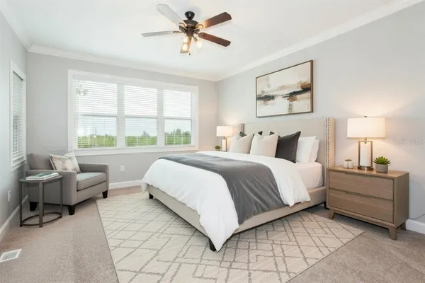 a bedroom with a bed and a couch