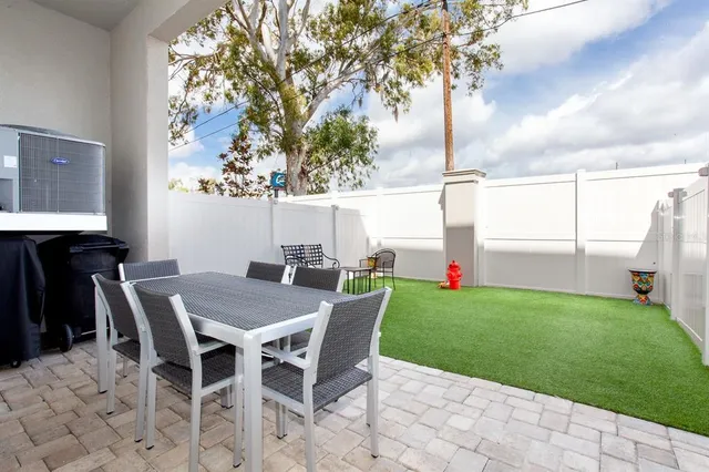 a view of an outdoor space with a table and chair