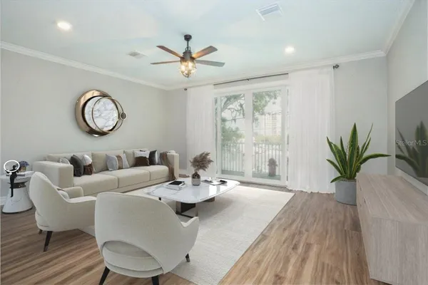 a view of a dining room with furniture window and wooden floor