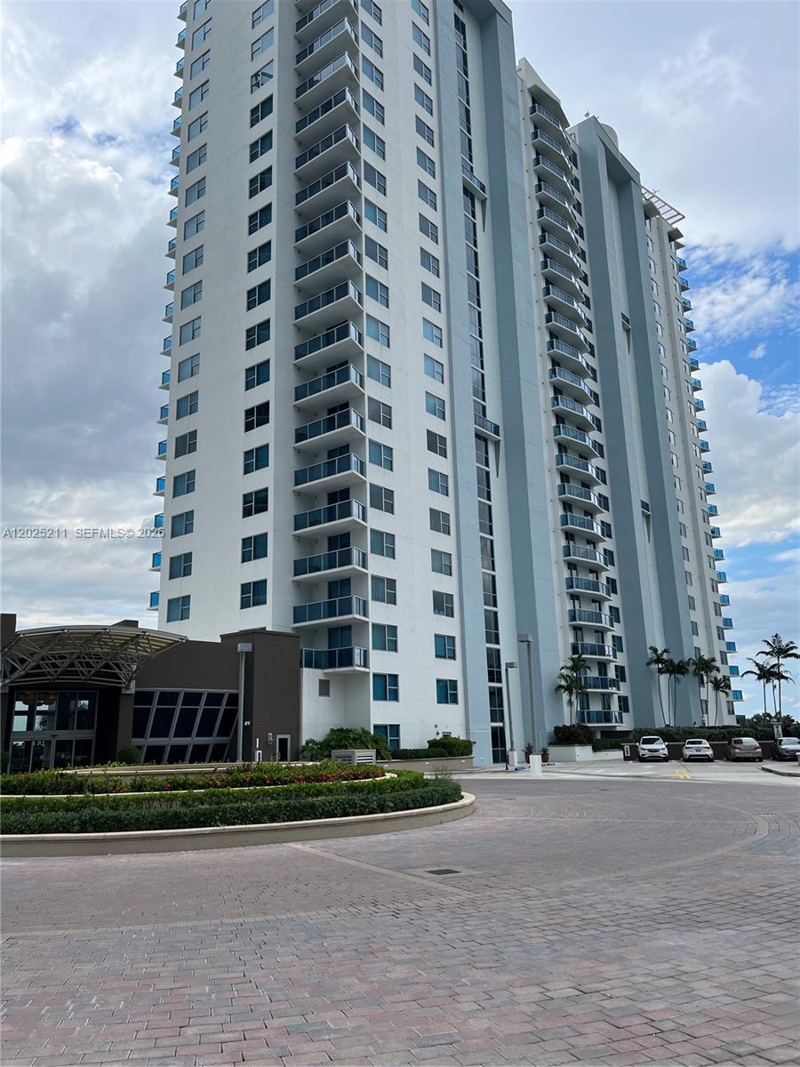 2681 North Flamingo Road, Unit 303S Sunrise, FL 33323 - Photo 1 of 18 front a building with a street