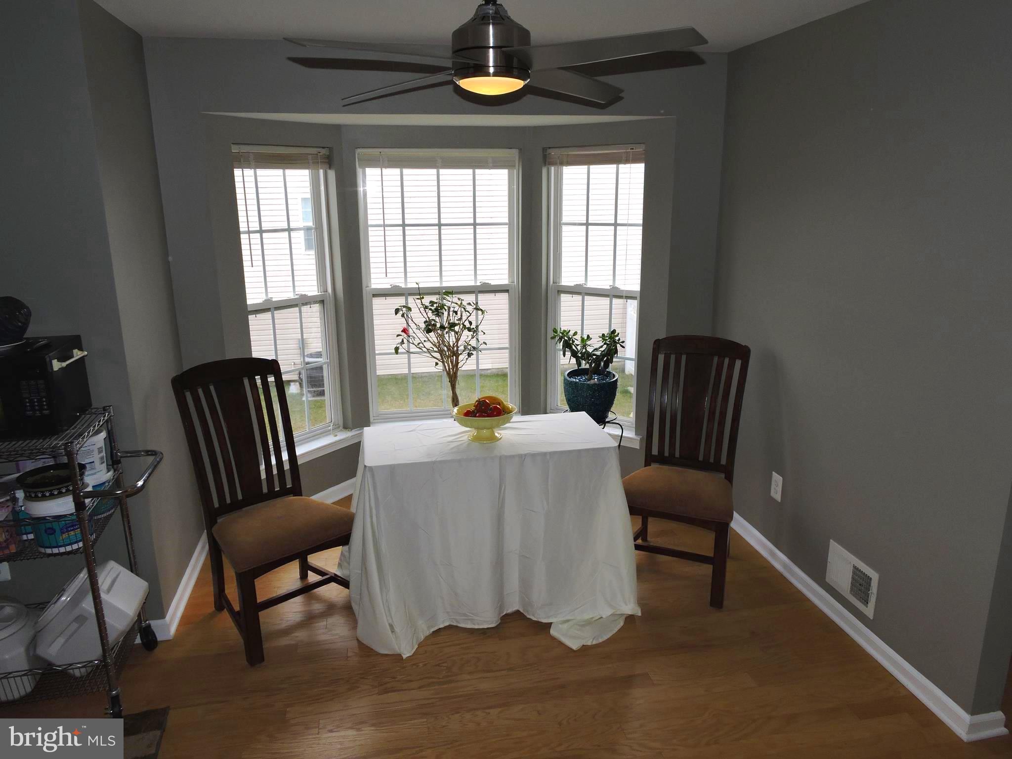 1227 Steed Street Ranson, WV 25438 - Photo 12 of 37 a living room with furniture and a window
