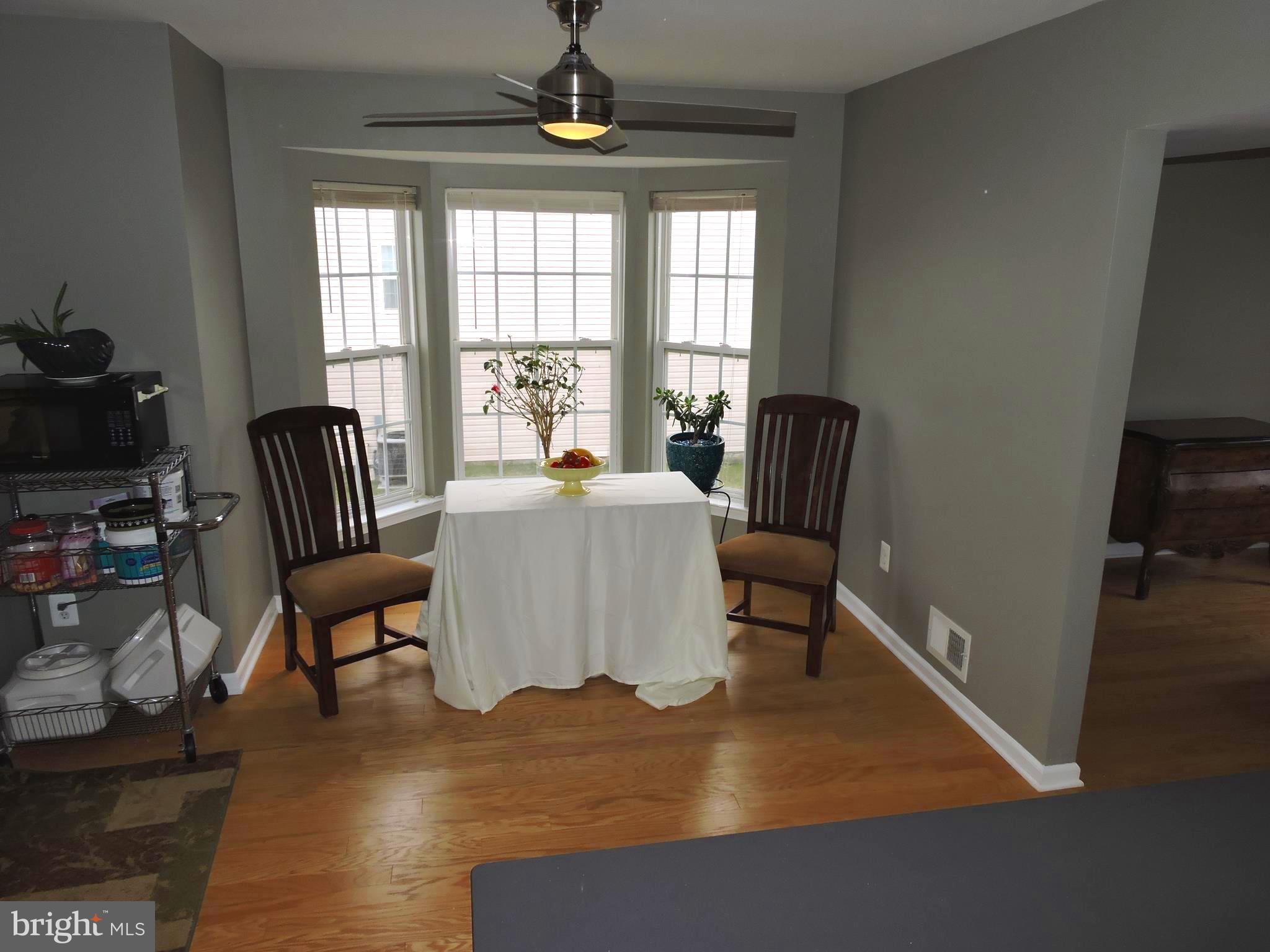 1227 Steed Street Ranson, WV 25438 - Photo 13 of 37 a living room with furniture rug and a window