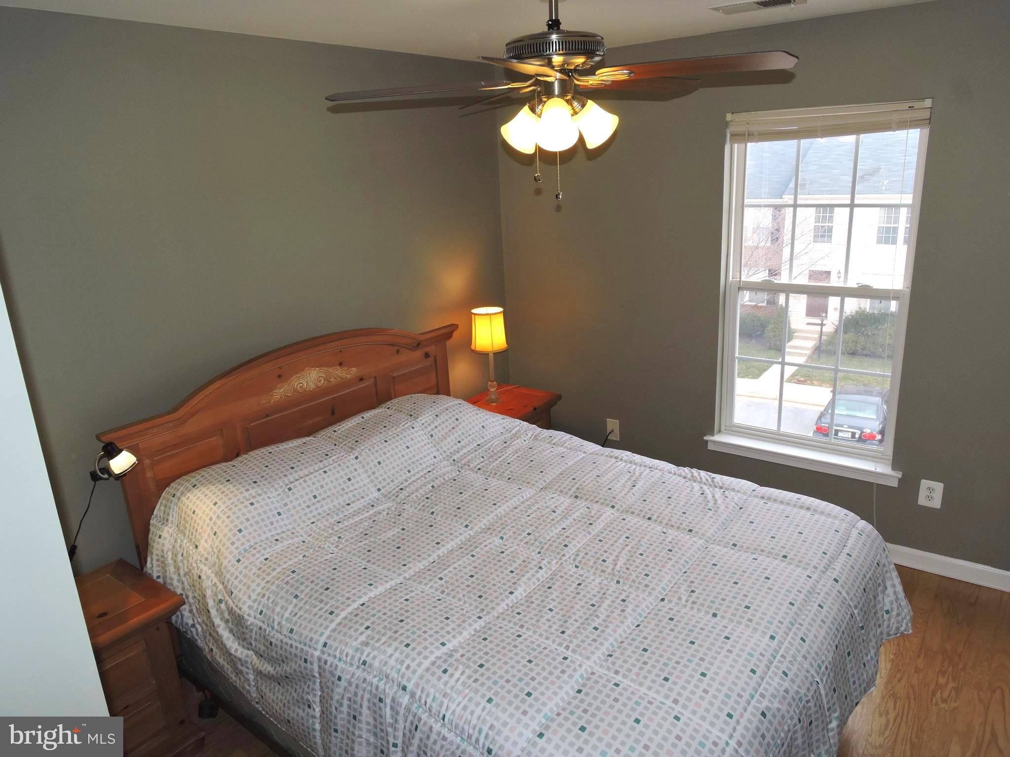 1227 Steed Street Ranson, WV 25438 - Photo 16 of 37 a bedroom with a bed and a chandelier