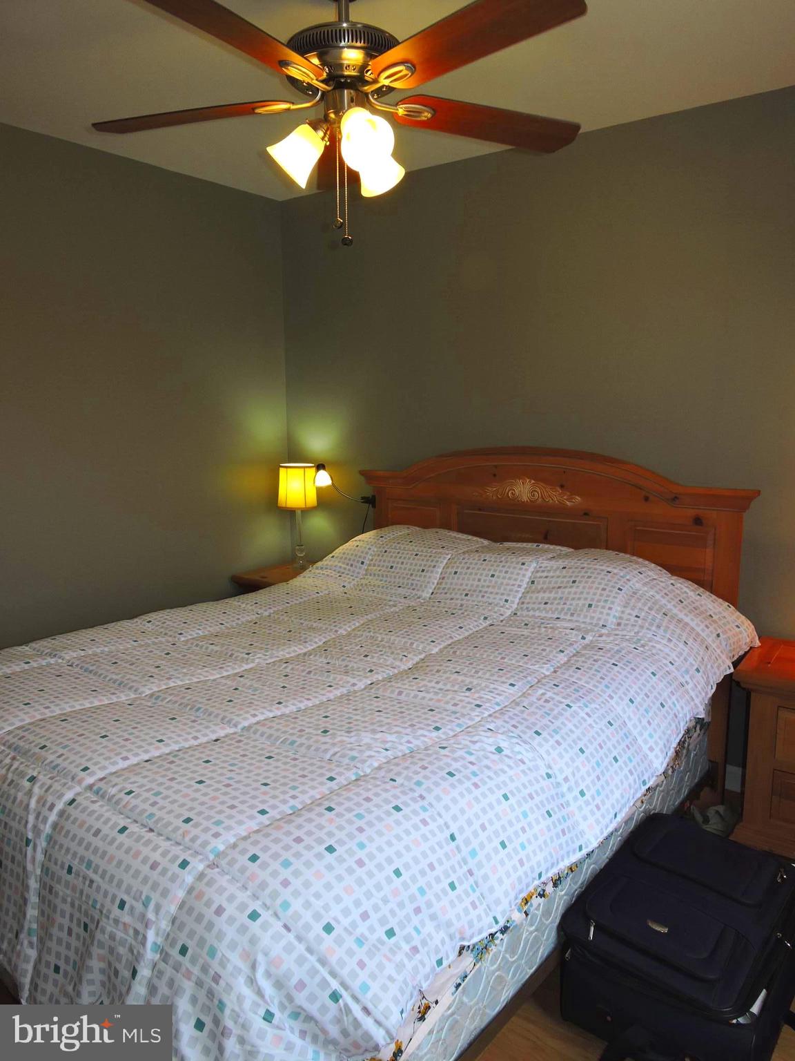 1227 Steed Street Ranson, WV 25438 - Photo 17 of 37 a bedroom with a bed and a chandelier