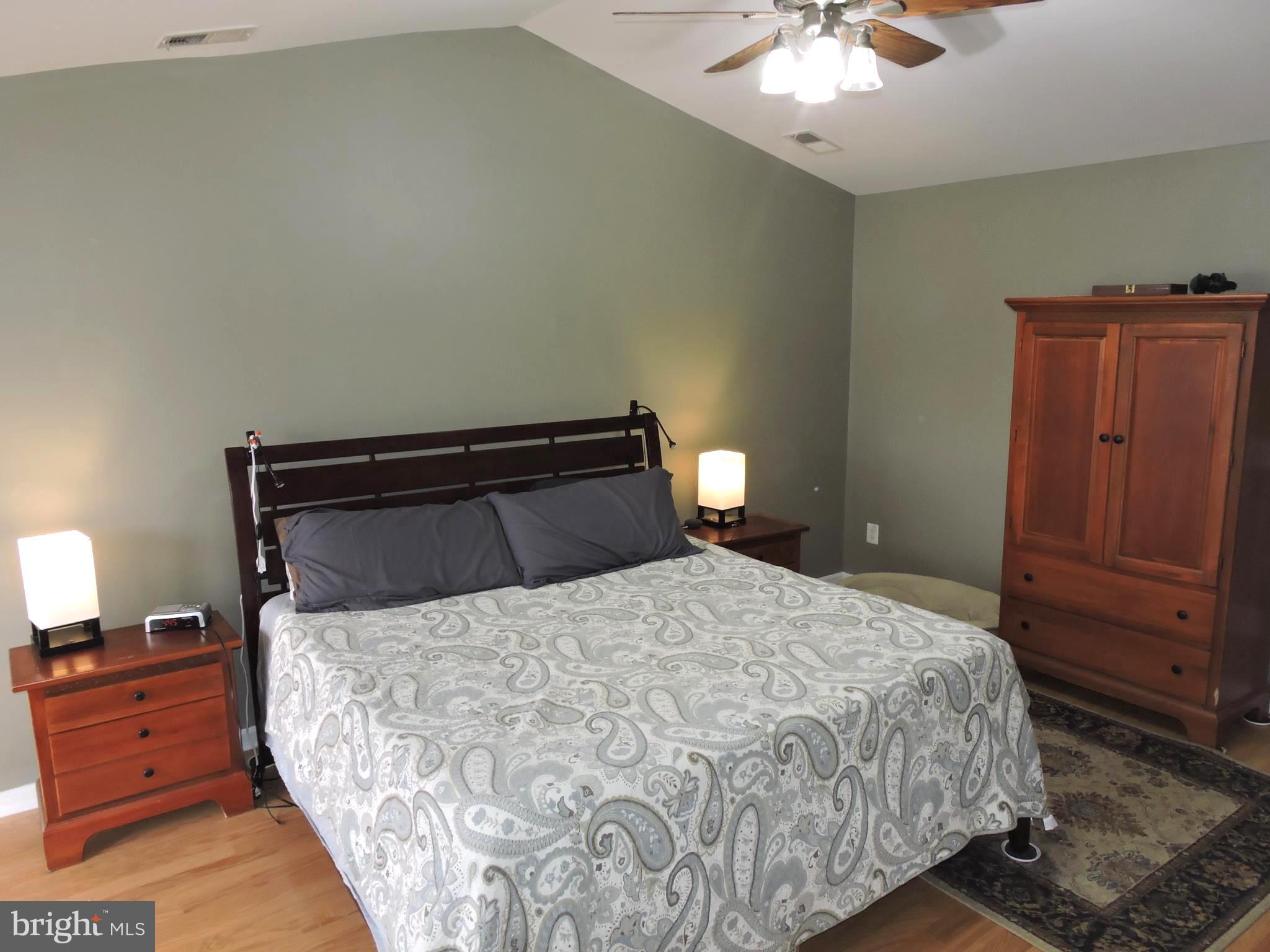 1227 Steed Street Ranson, WV 25438 - Photo 20 of 37 a bedroom with a bed and wooden floor