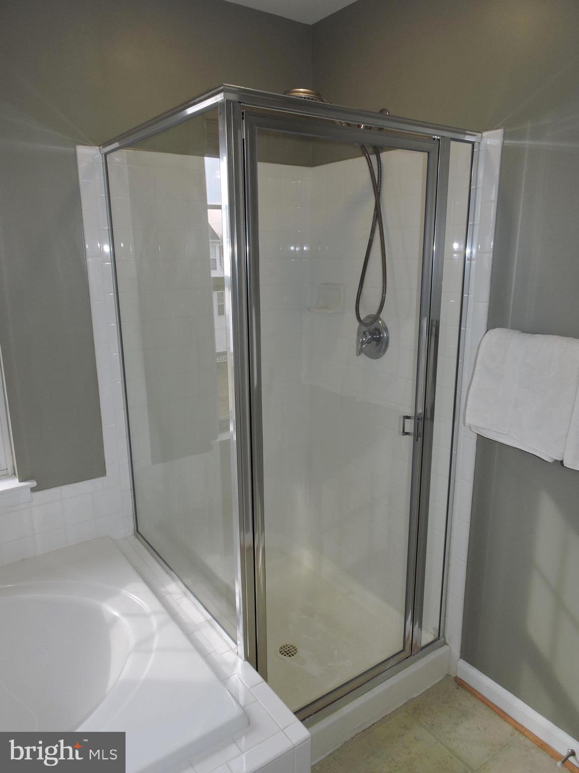 1227 Steed Street Ranson, WV 25438 - Photo 25 of 37 a bathroom with a glass shower door