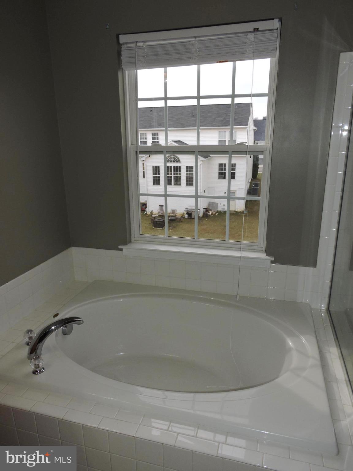 1227 Steed Street Ranson, WV 25438 - Photo 26 of 37 a bath tub sitting next to a window