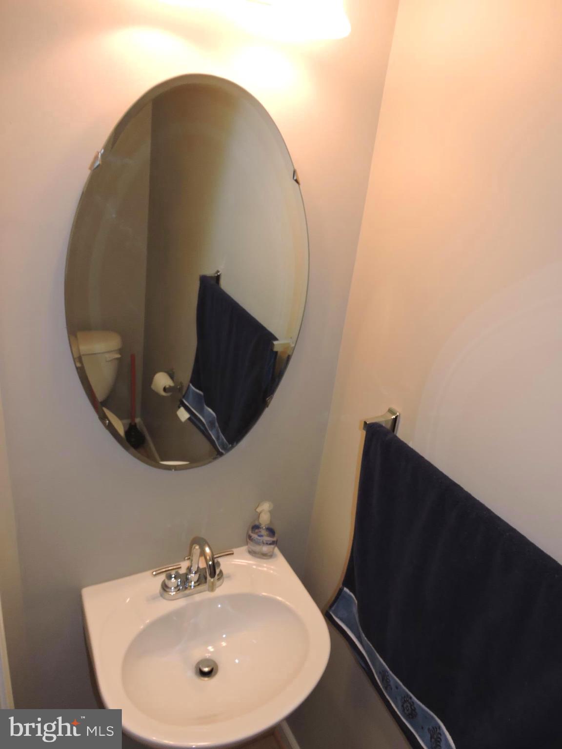 1227 Steed Street Ranson, WV 25438 - Photo 4 of 37 a bathroom with a sink and mirror