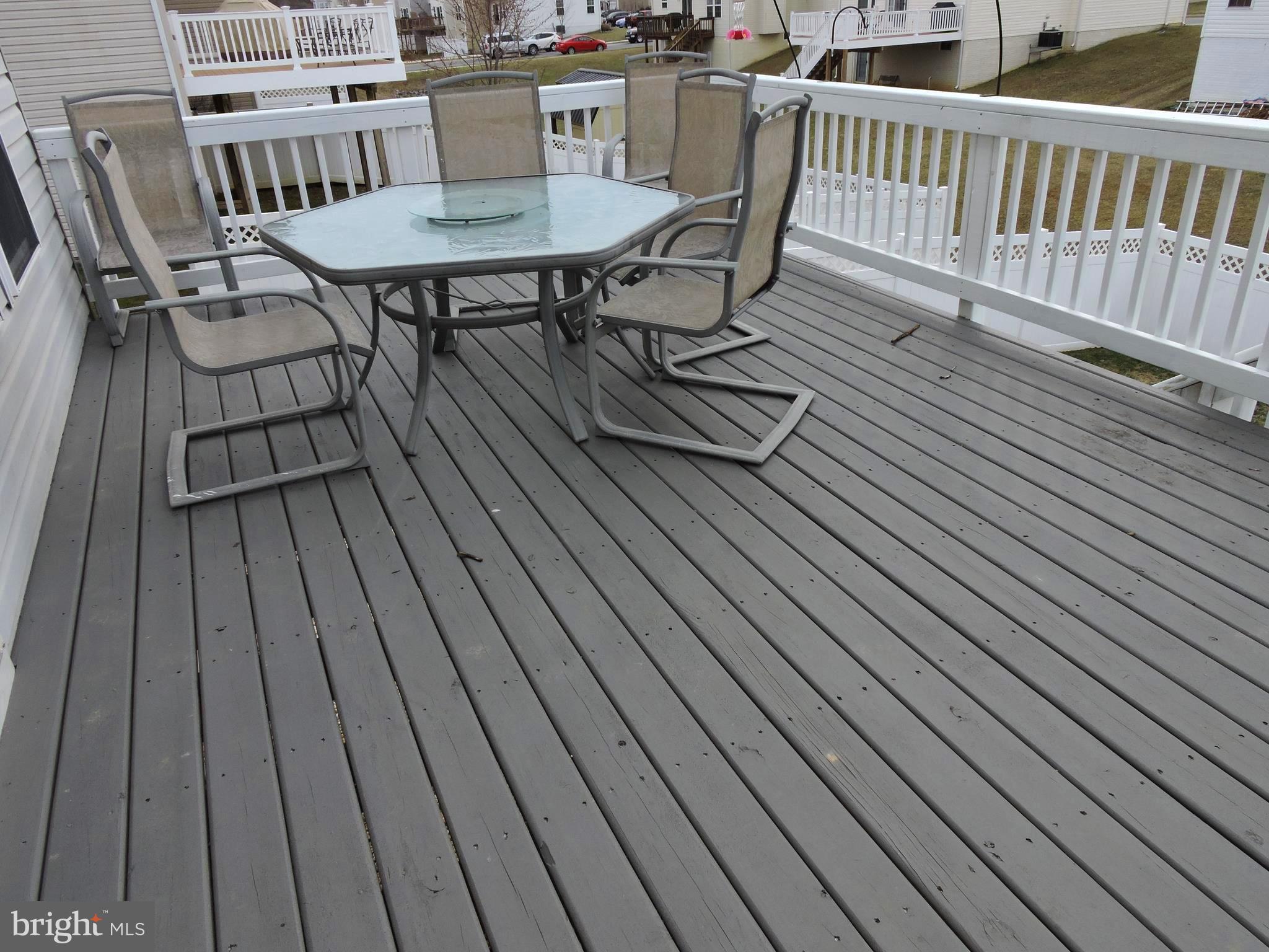 1227 Steed Street Ranson, WV 25438 - Photo 32 of 37 a view of a chairs on wooden deck