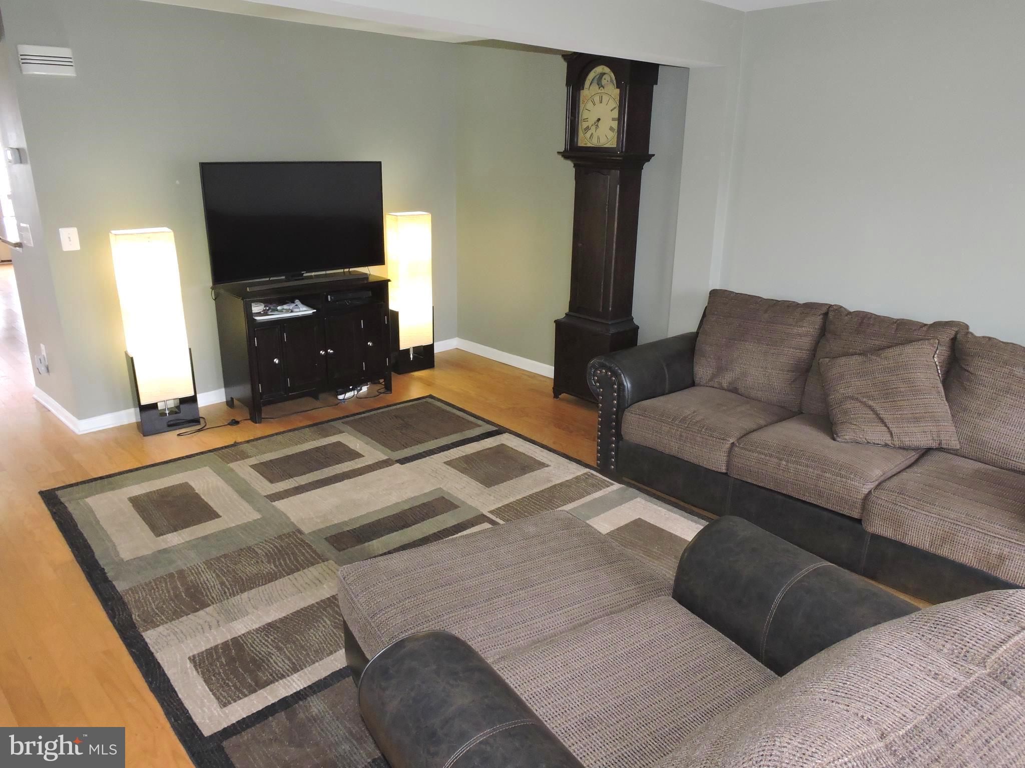 1227 Steed Street Ranson, WV 25438 - Photo 6 of 37 a living room with furniture and a flat screen tv