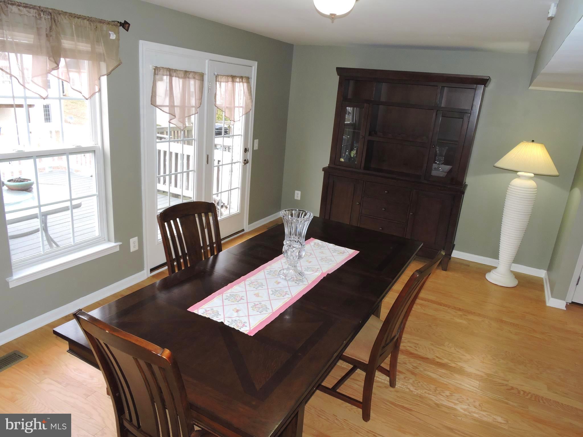 1227 Steed Street Ranson, WV 25438 - Photo 7 of 37 a view of a dining room with furniture and wooden floor