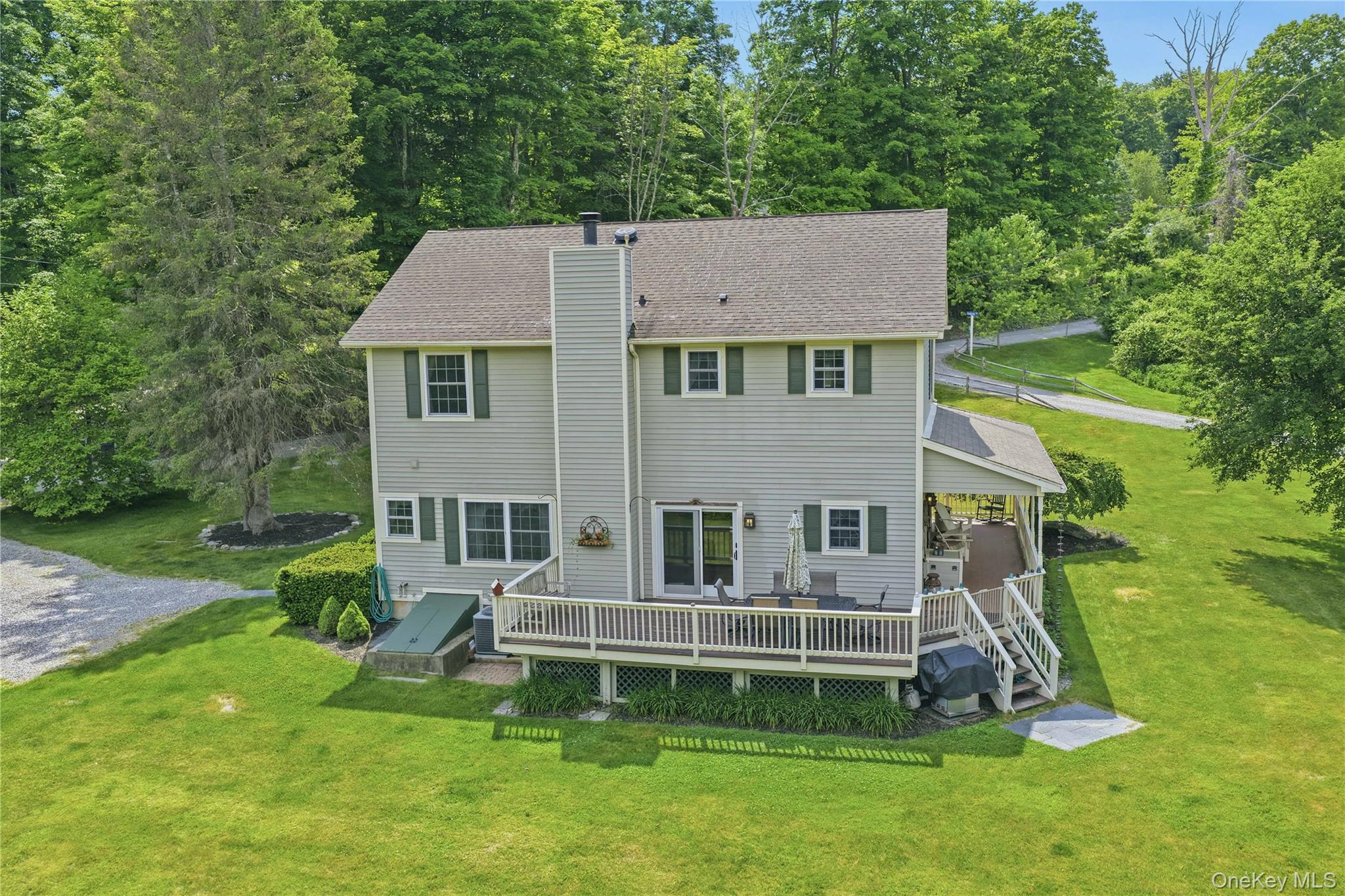 226 Cart Road, Unit C Dover Plains, NY 12522 - Photo 5 of 47 Back yard with house, deck and wraparound porch