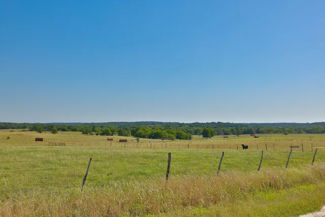 a view of a lake with houses in background