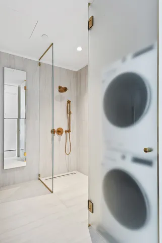 a bathroom with a double vanity sink a mirror and a shower