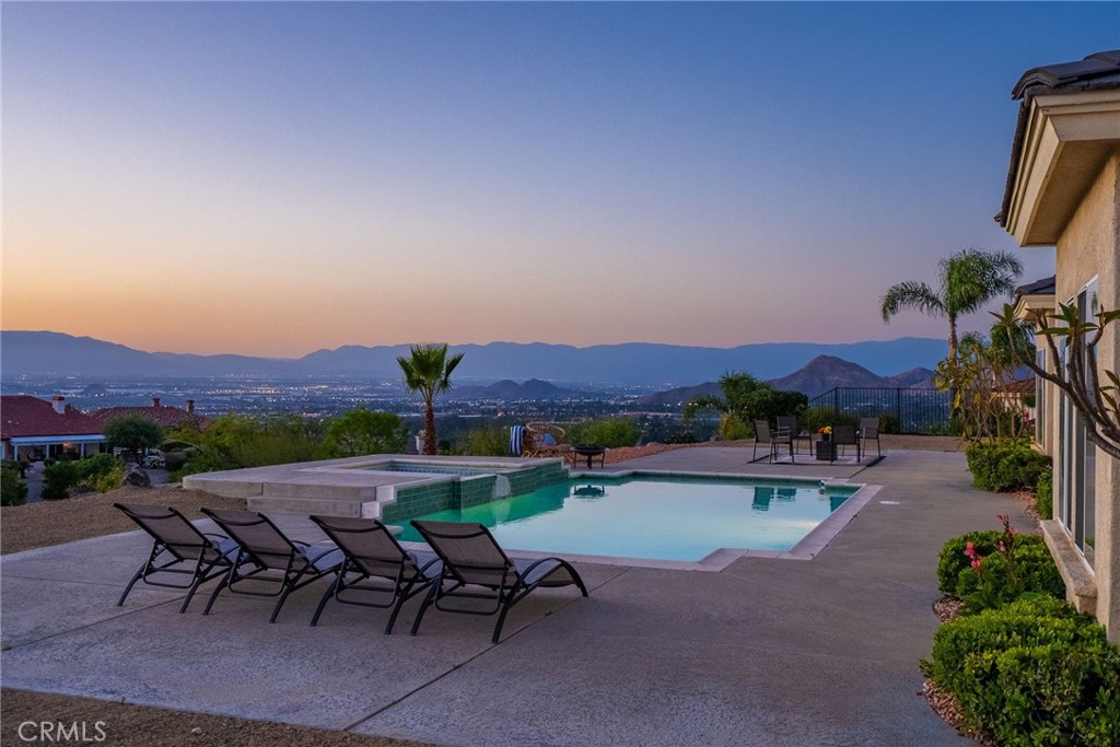 6201 Omega Street Riverside, CA 92506 - Photo 49 of 70 a view of a patio with a table and chairs under an umbrella