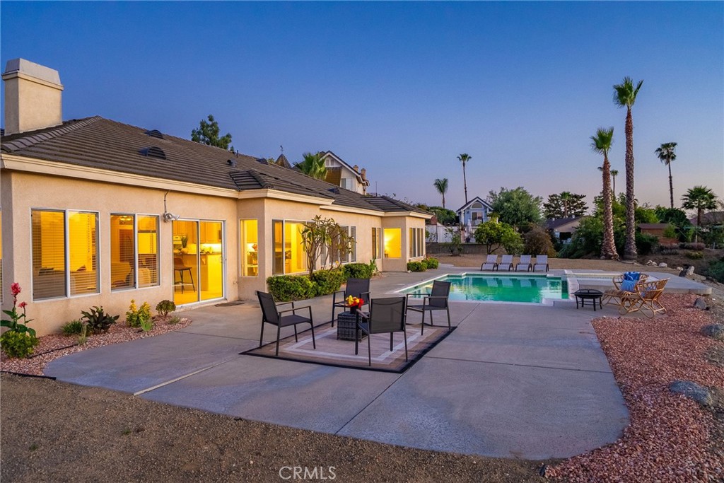 6201 Omega Street Riverside, CA 92506 - Photo 50 of 70 a view of a patio with couches table and chairs and potted plants
