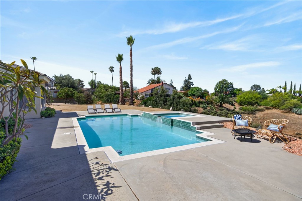 6201 Omega Street Riverside, CA 92506 - Photo 51 of 70 a view of a swimming pool with a lounge chair