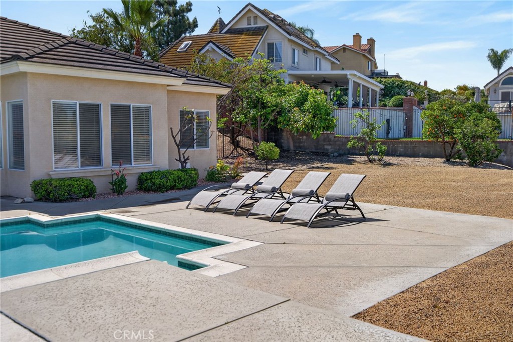 6201 Omega Street Riverside, CA 92506 - Photo 53 of 70 a view of a house with backyard sitting area and swimming pool