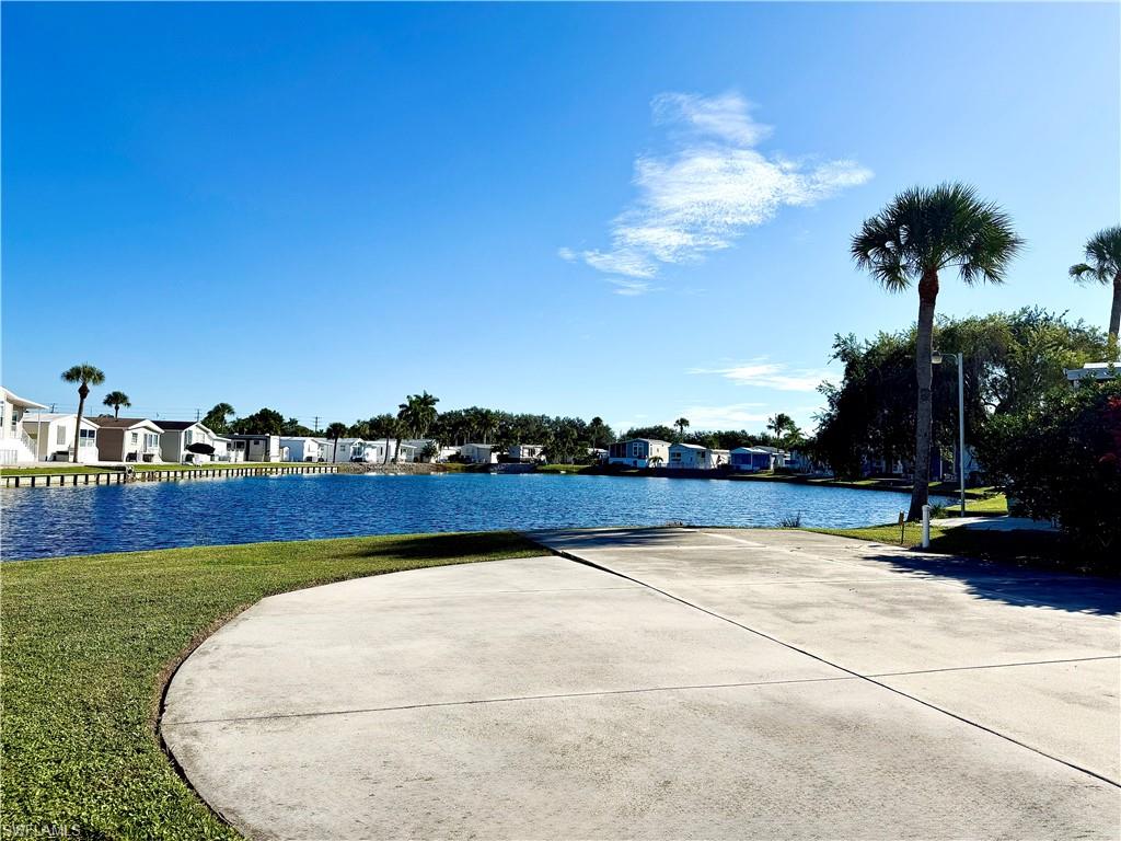 351 Bobcat Run Naples, FL 34114 - Photo 5 of 38 a view of swimming pool and outdoor seating