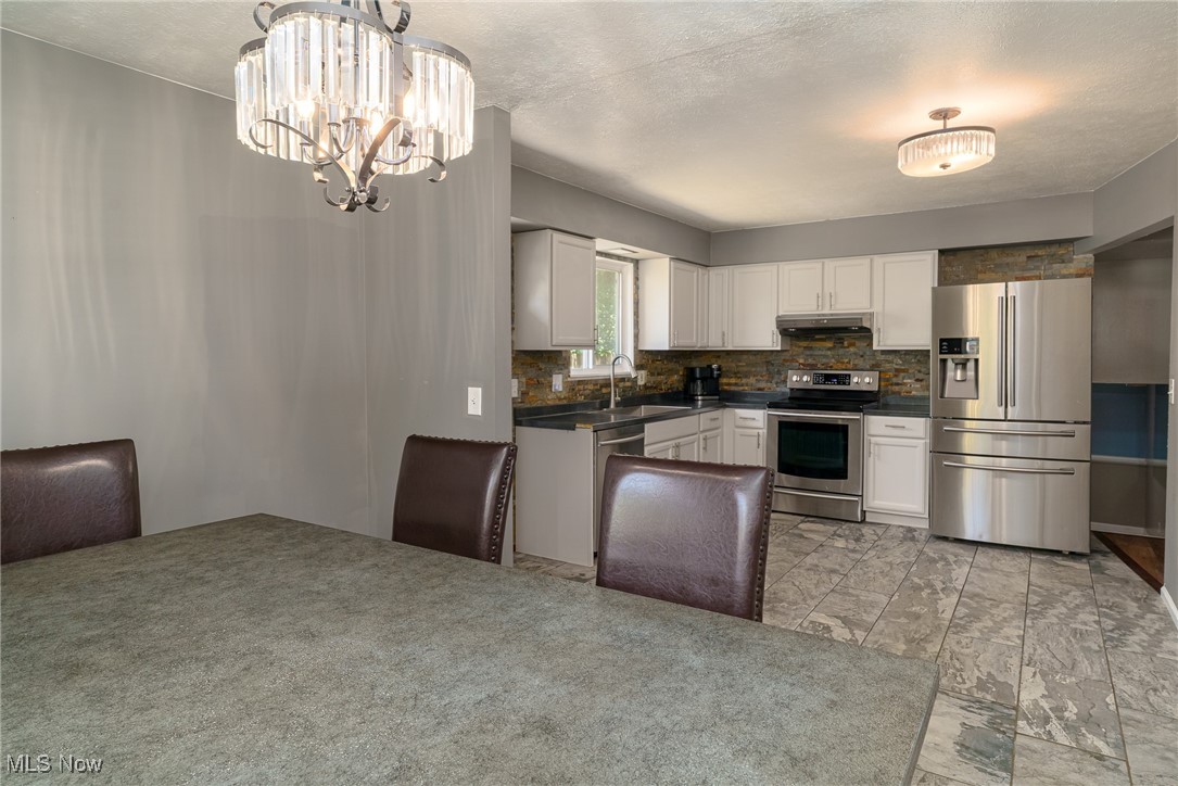 5497 Lear Nagle Road North Ridgeville, OH 44039 - Photo 13 of 33 View from dining area into kitchen