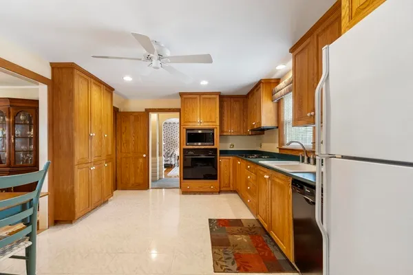 a kitchen with stainless steel appliances a refrigerator and a stove