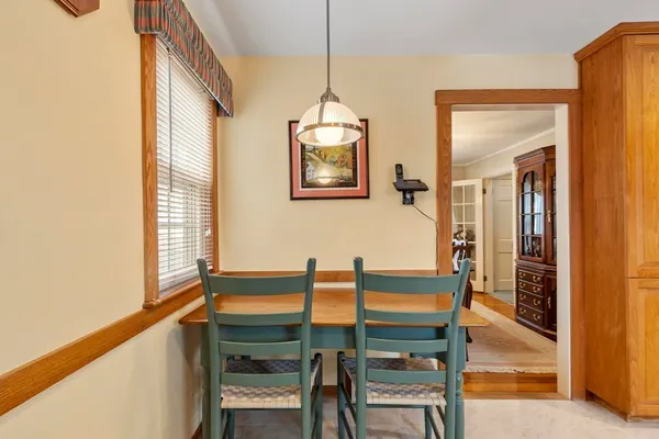 a view of a hallway with furniture and windows