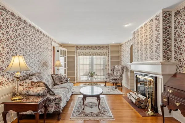 a living room with furniture a window and a fireplace