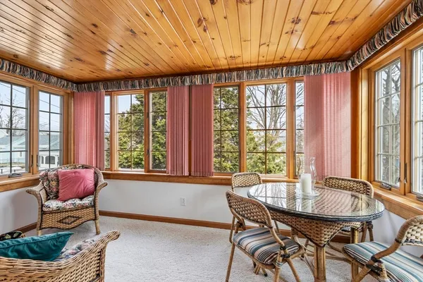 a dining room with furniture and windows