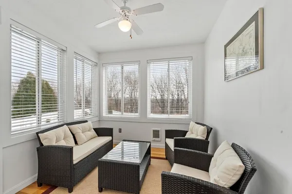 a living room with furniture and a window