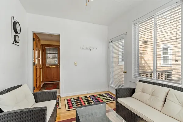 a living room with furniture and a window