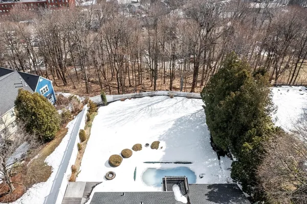 a view of a swimming pool with a yard