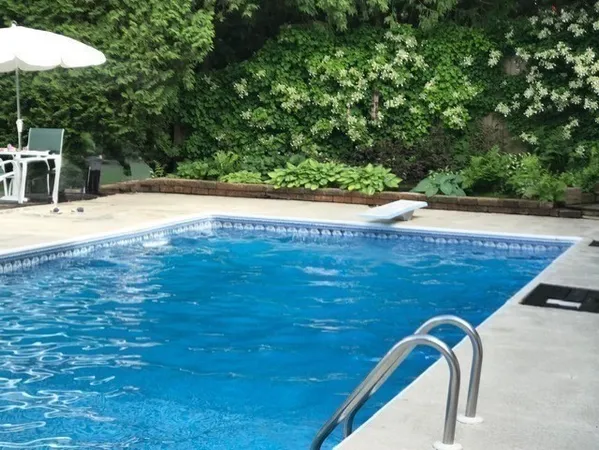 a view of a swimming pool with an outdoor space