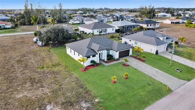 an aerial view of multiple houses with yard