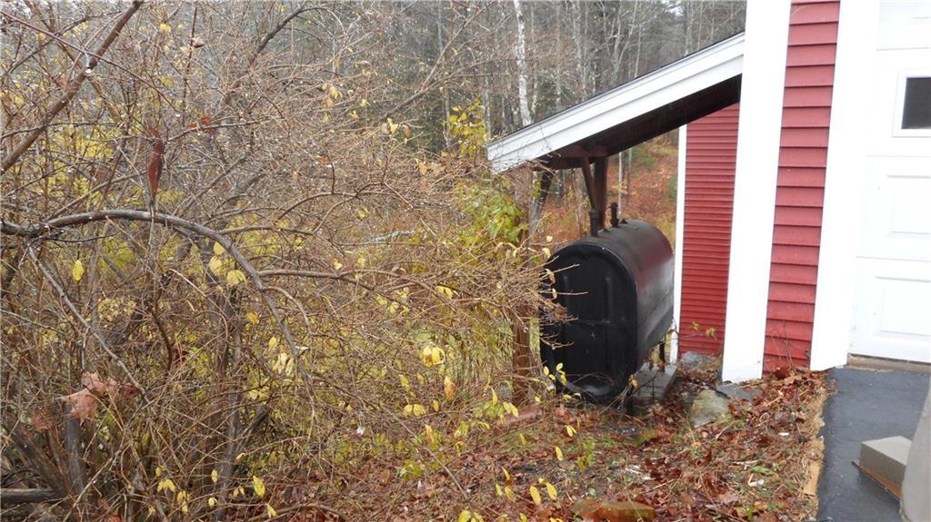 108 Seavey Corner Road Mount Vernon, ME 04352 - Photo 6 of 32 oil tank with roof covering it.
