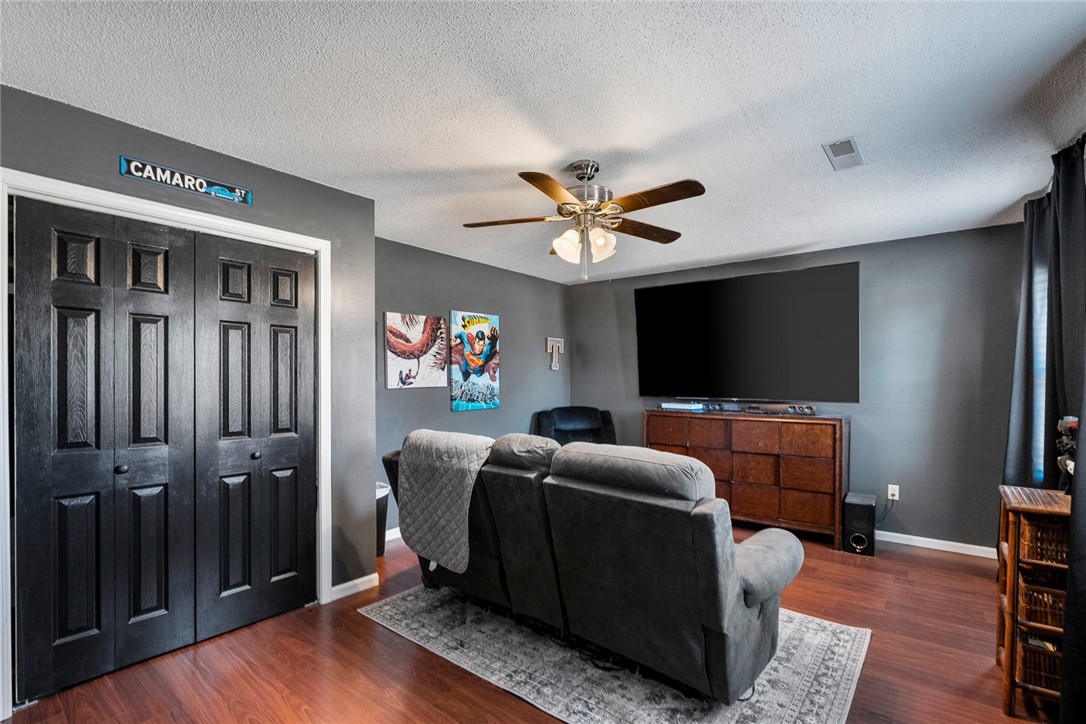 112 C-10-220 Anderson, SC 29621 - Photo 34 of 45 This inviting living space features rich hardwood flooring and a functional ceiling fan for comfort.