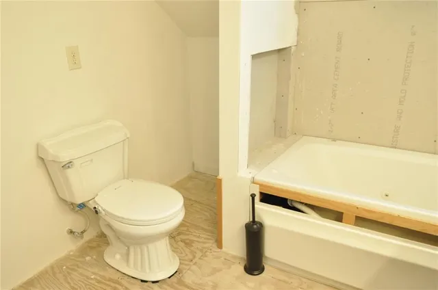 a bathroom with a toilet and a sink