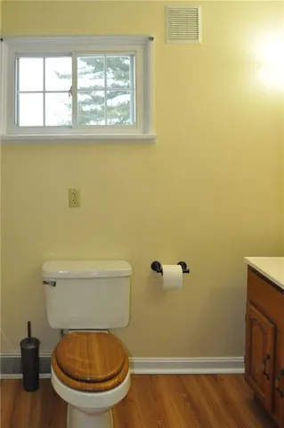 a bathroom with a toilet and a sink