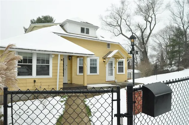 a front view of a house with glass windows