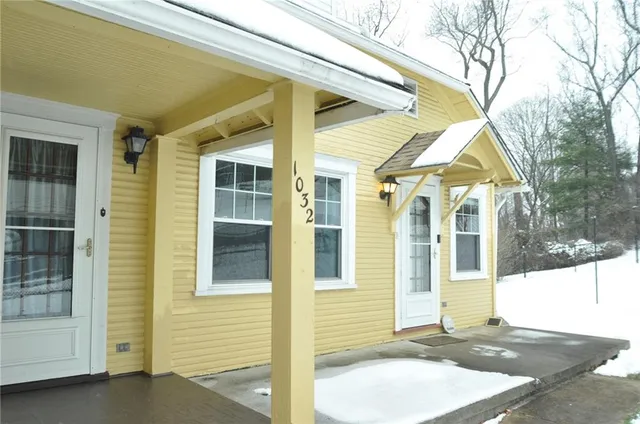 a view of a brick house with a large windows