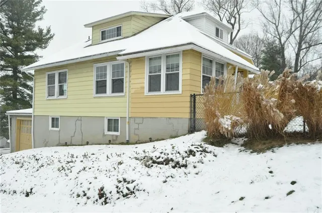a view of a house with a snow